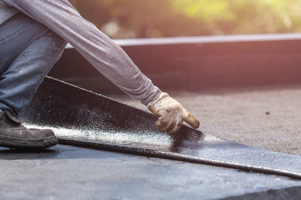 Professional Basement Waterproofing technician working in Eagle, MI